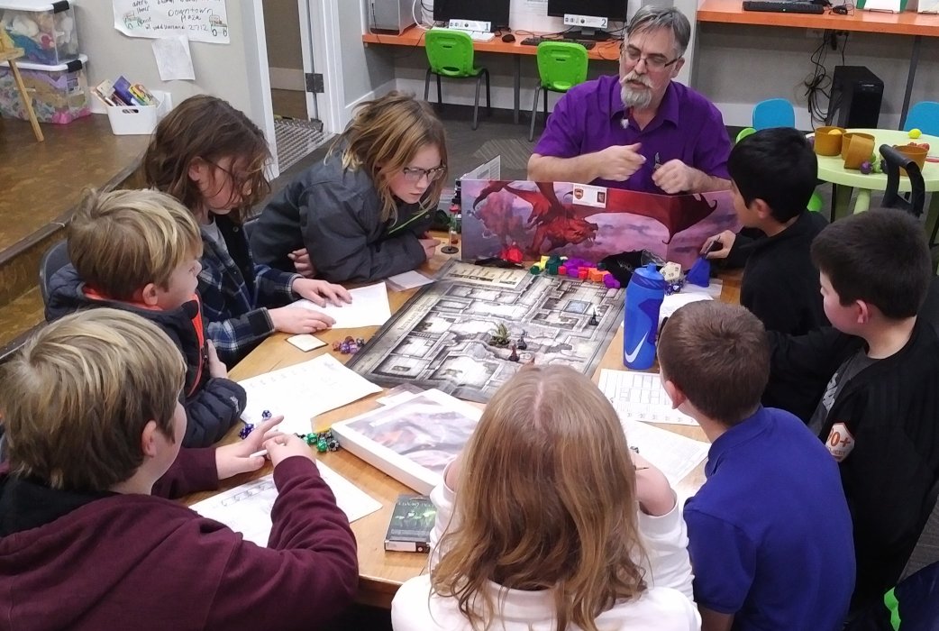 RPG Research Volunteers running community role-playing game program at Spark Central, as features in the Inlander Magazine.